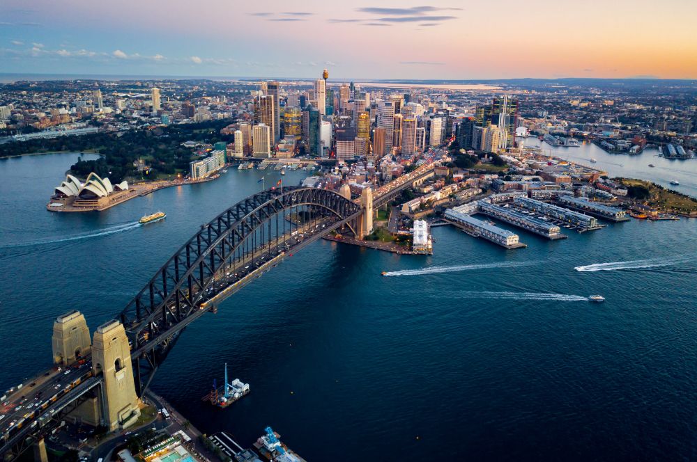 Aerial view of Sydney with Sydney Harbour Bridge and Sydney Opera House in the background