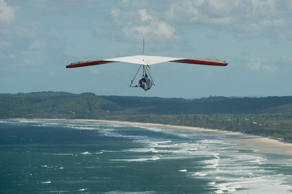 Hang gliding over scenic coastal landscapes