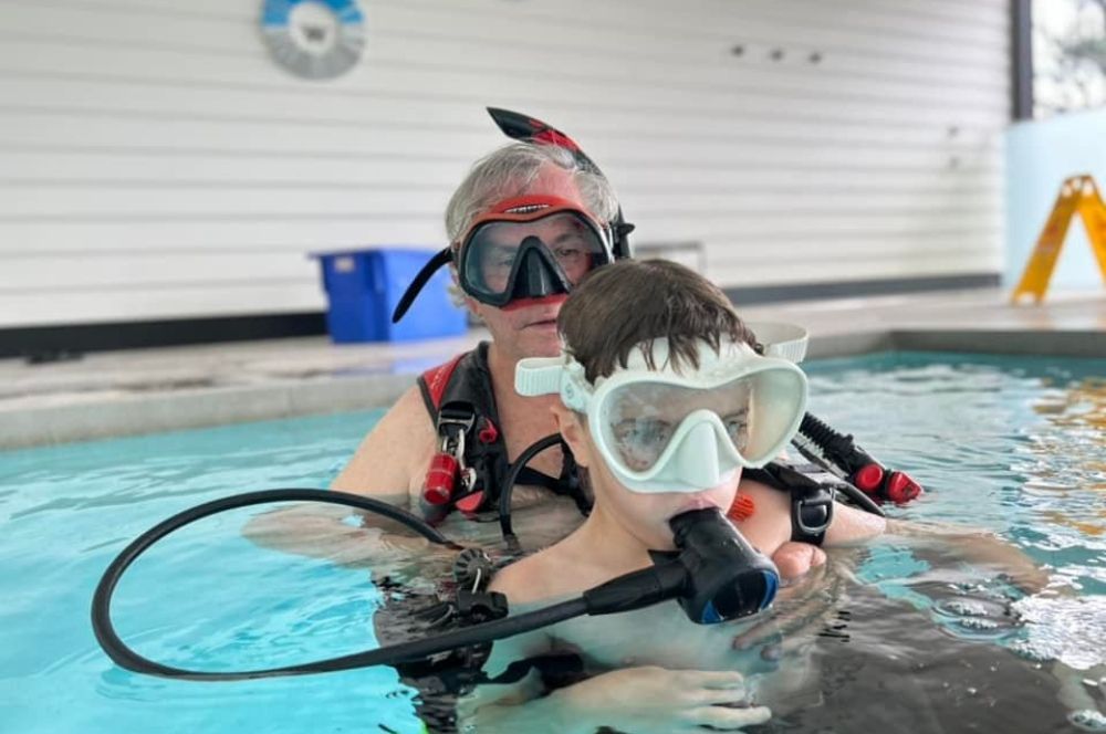 Teaching my grandson how to scuba dive