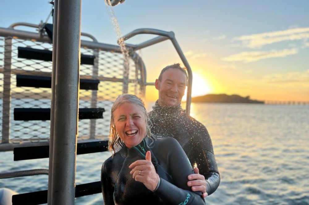 Divemasters enjoying a hot shower after a boat dive