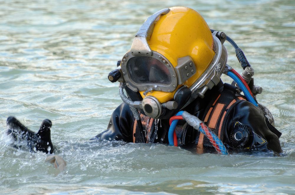 Scuba diver in the ocean with commercial diving gear