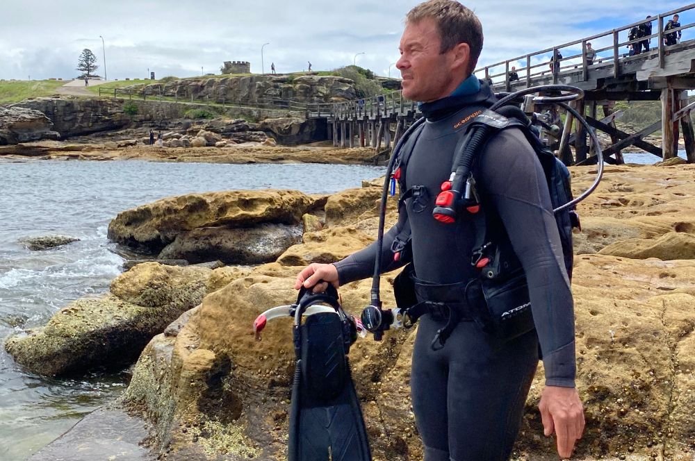 Scuba diver familiarizing with dive site conditions