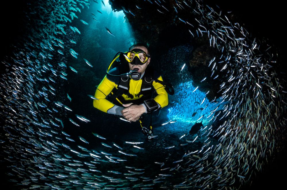 A deep sea diver exploring the ocean depths