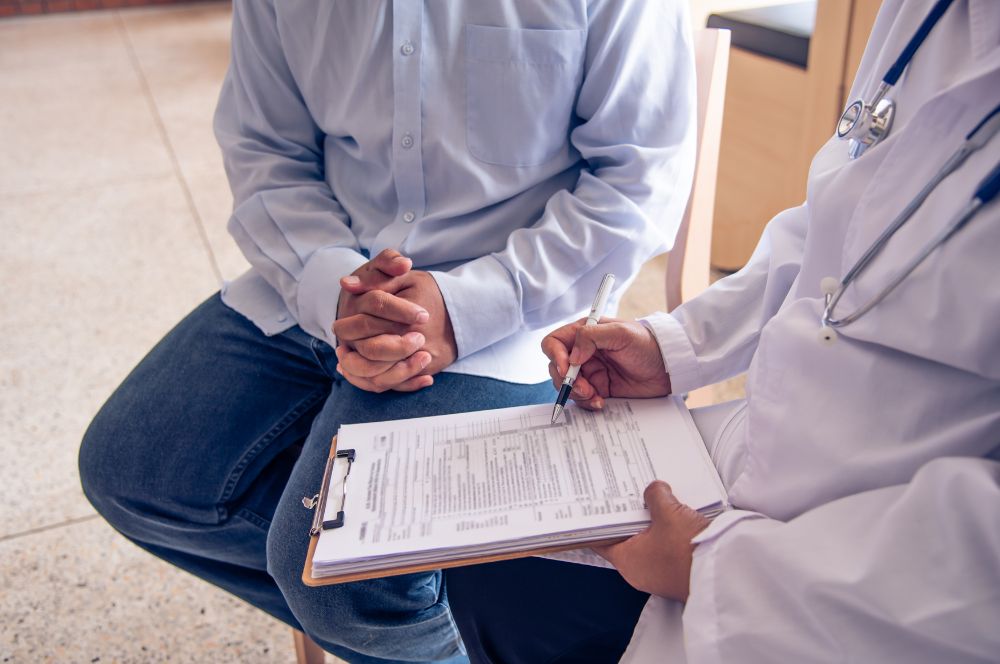 A doctor and a patient discussing prescription medication