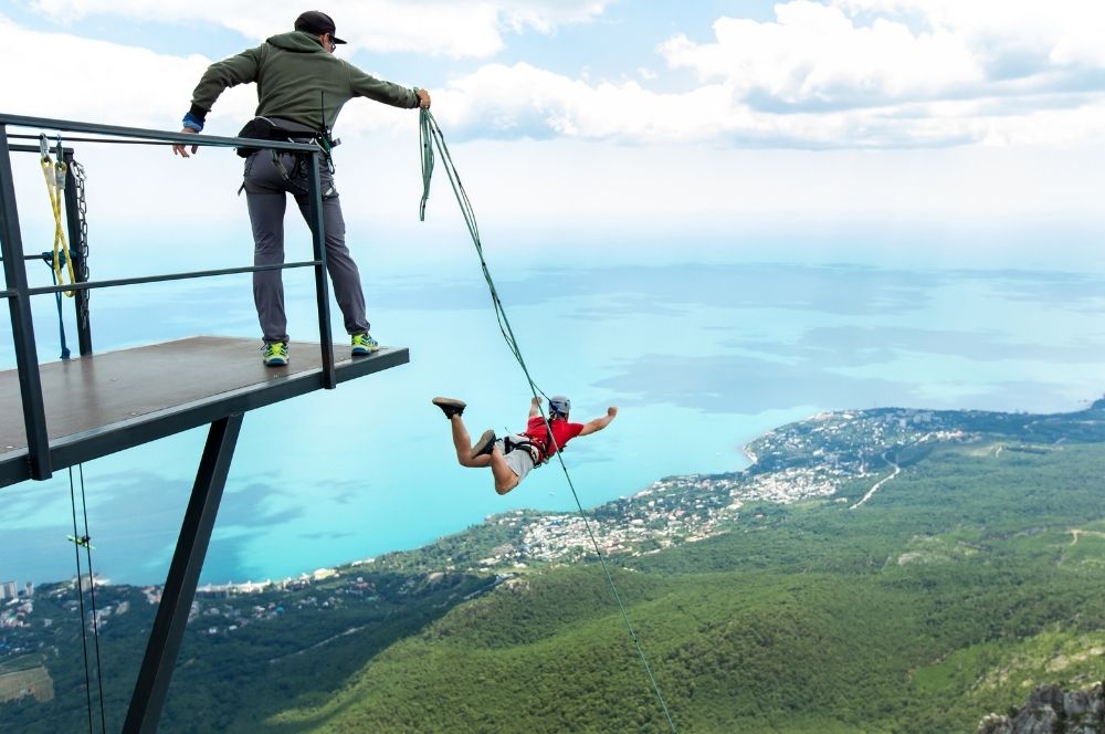 Bungee jumping over a scenic landscape