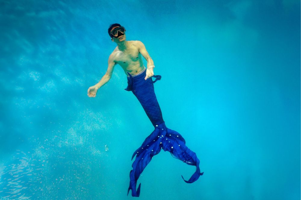 An image of a person wearing a mermaid tail while doing mermaid workouts to help with choosing the right tail.