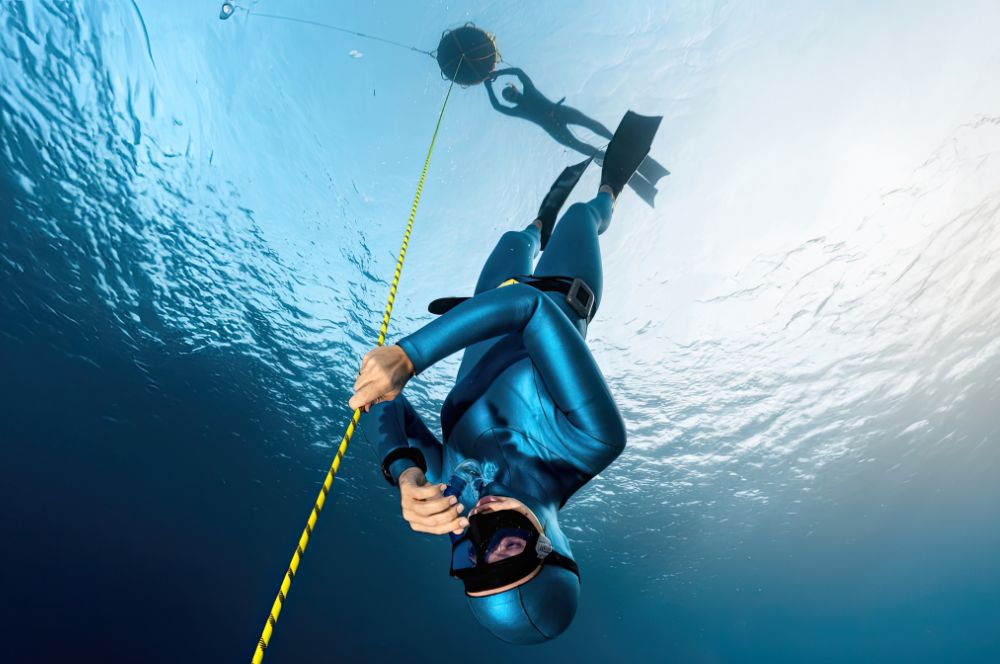 A person freediving in the ocean, enjoying the freedom of the underwater world