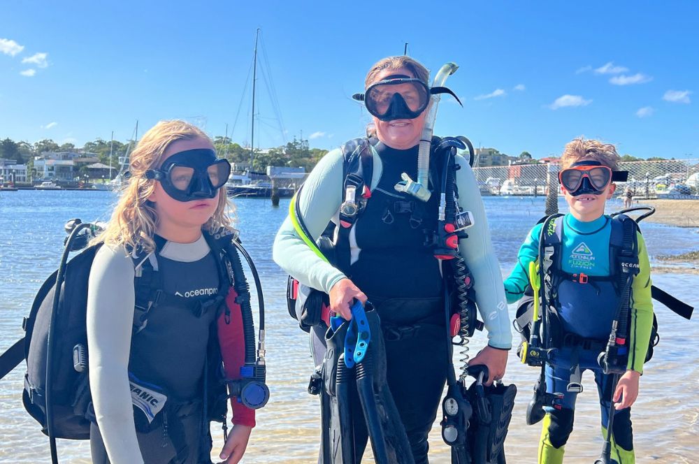 Children learning to scuba dive
