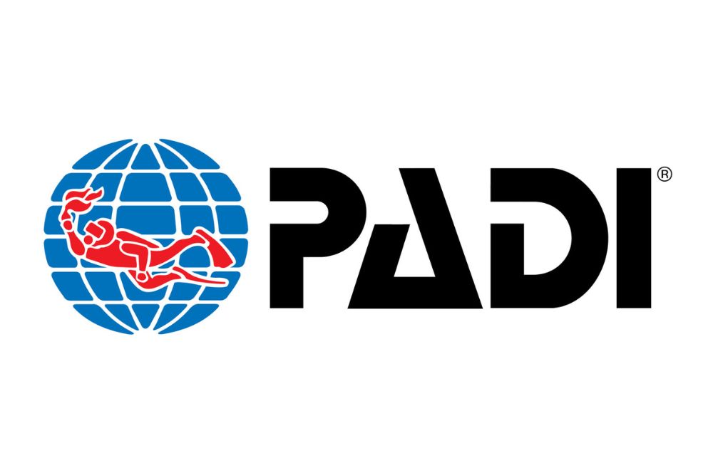 An image of the PADI logo, representing the founding and evolution of the PADI organization in the scuba diving industry.