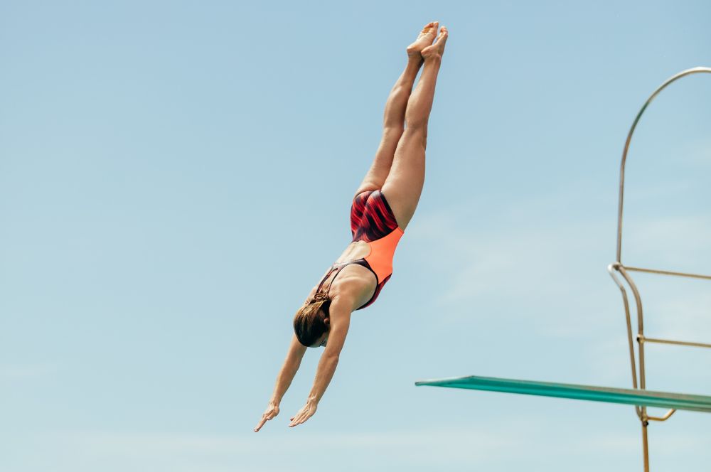 A person diving from the highest platform