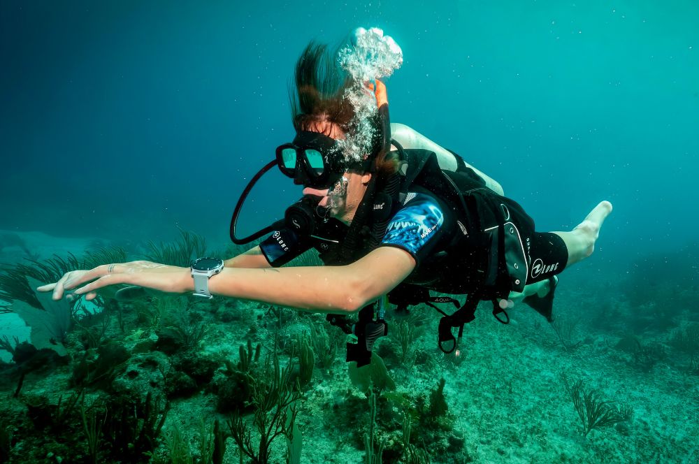 A disabled diver triumphantly exploring the underwater world