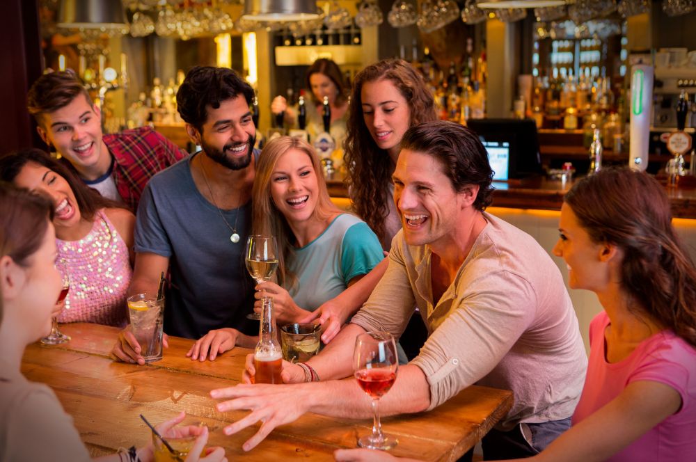 A group of international students enjoying drinks and music at one of the top bars and clubs