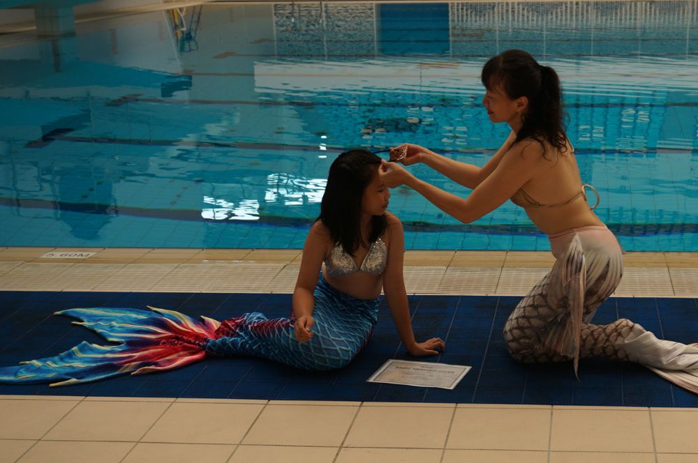 A person attending a mermaid class