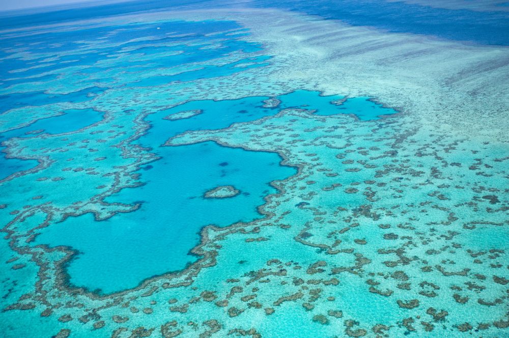 Aerial view of the Great Barrier Reef with crystal clear waters and coral formations