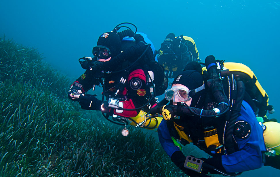 Scuba diver in the ocean with technical diving gear